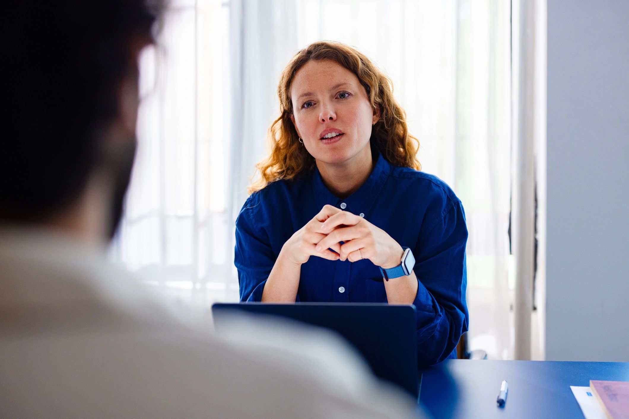 Recruiter conducting a professional interview at a desk